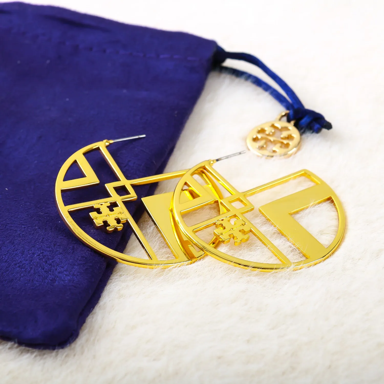 gold geometric logo hoop earring