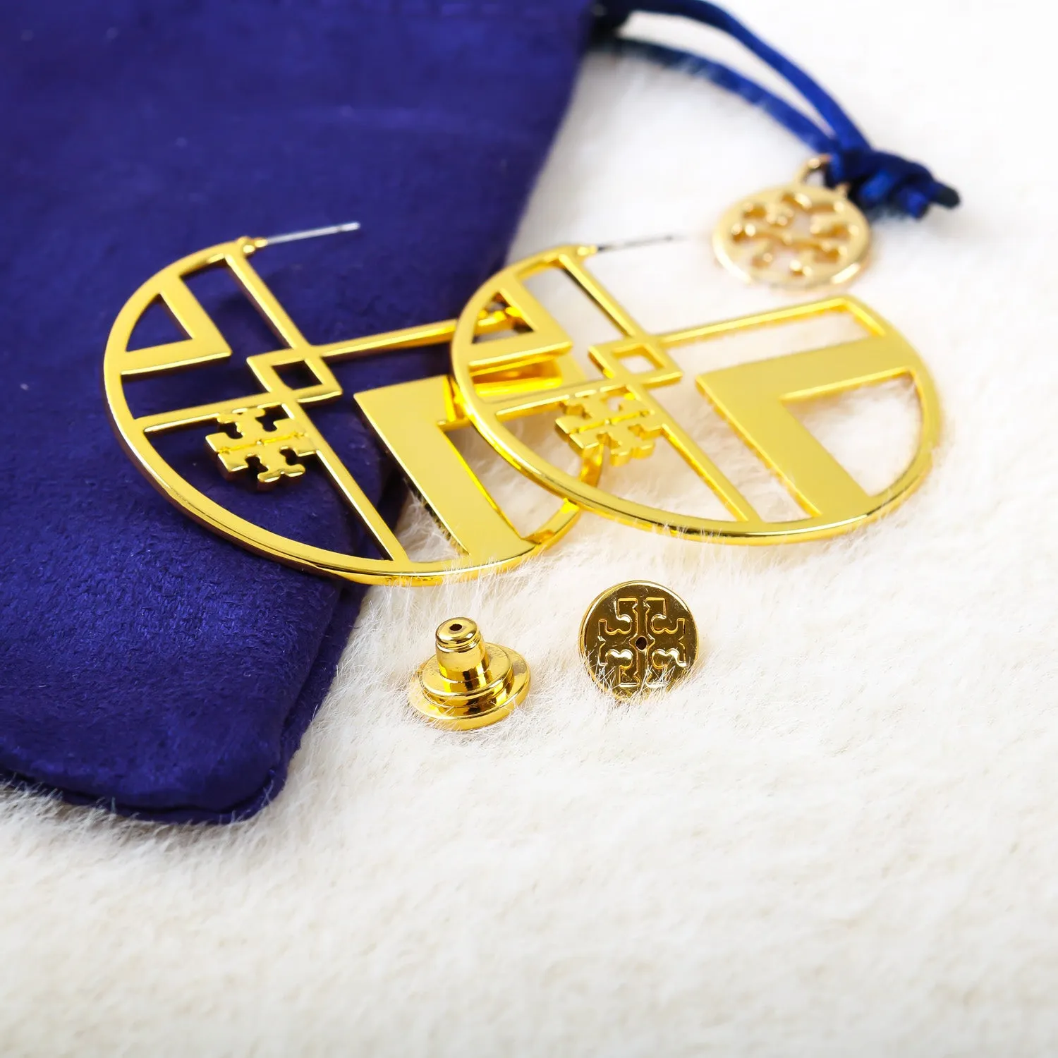 gold geometric logo hoop earring