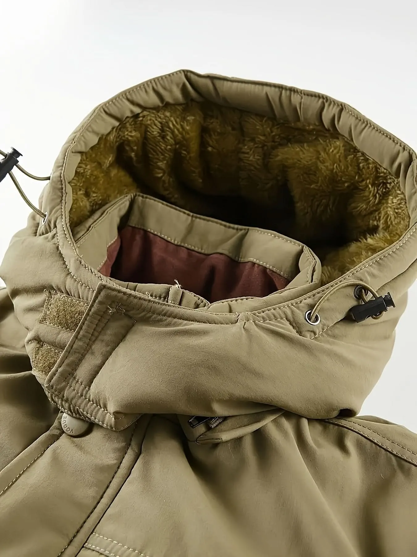 Men's Water-Resistant Softshell Jacket With Hood, Fleece Lining, Multiple Pockets, And Adjustable Hem For Outdoor And Casual Wear